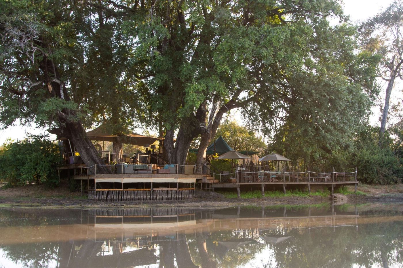 Deck overlooking Kanga Pan with elephants drinking at Kanga Expeditions, Mana Pools.
