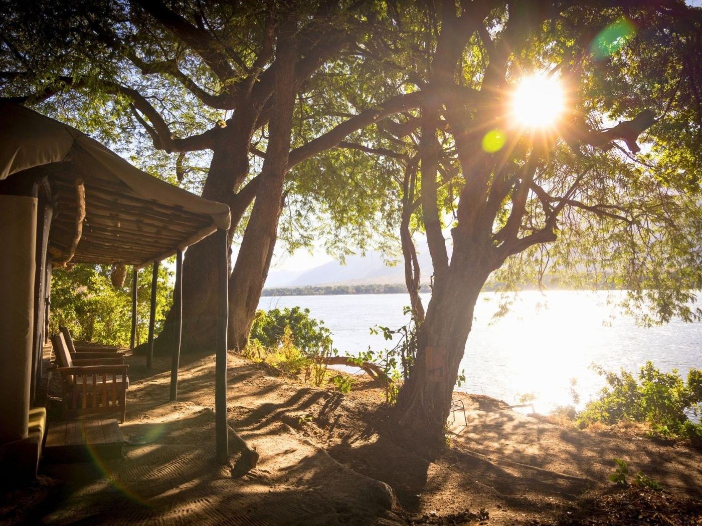Tent deck overlooking the Zambezi River at sunset at Little Vundu, Mana Pools.