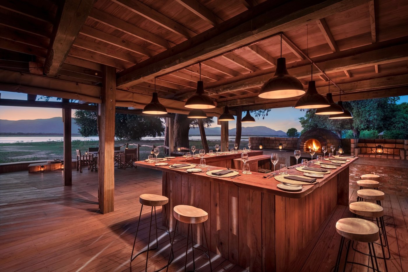 Open-air dining room overlooking the Zambezi River at Nyamatusi Camp.